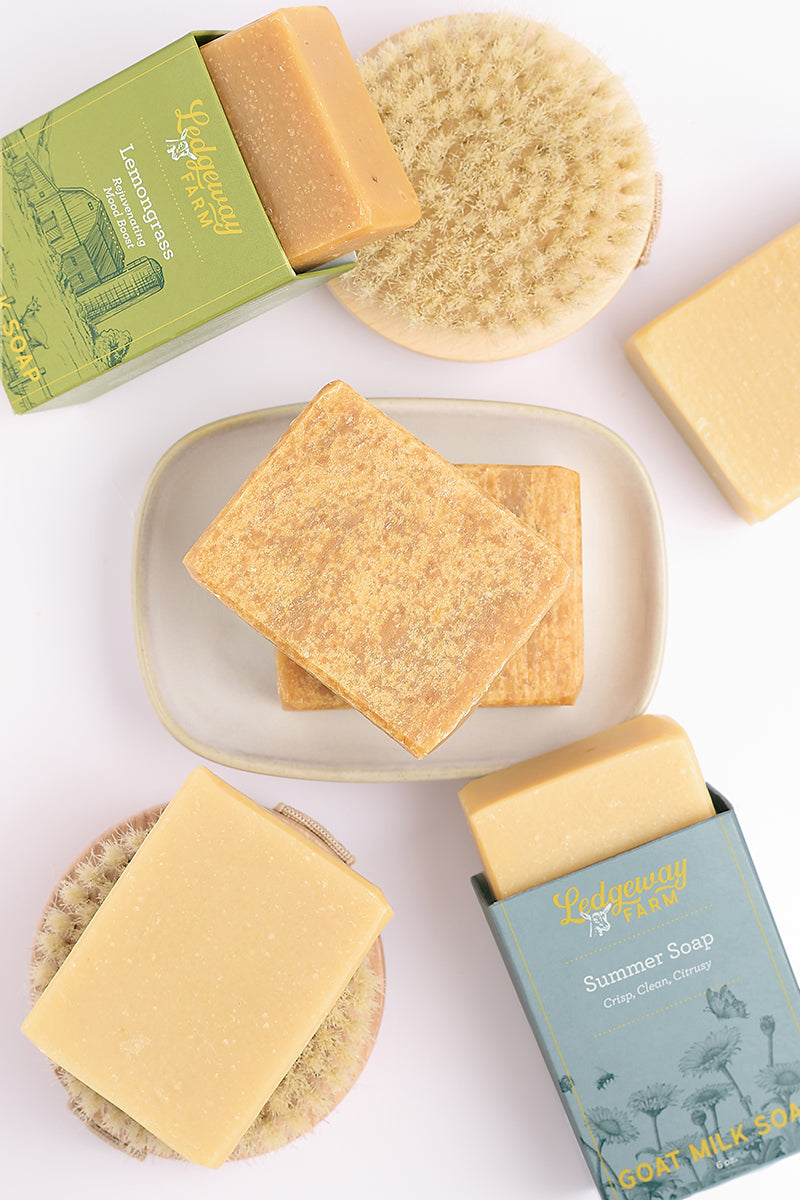 Natural soap bars and packaging on a white background