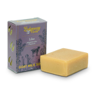 Lilac goat milk soap at an angle with the packaging.