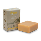 Goat milk soap bar with packaging on a white background