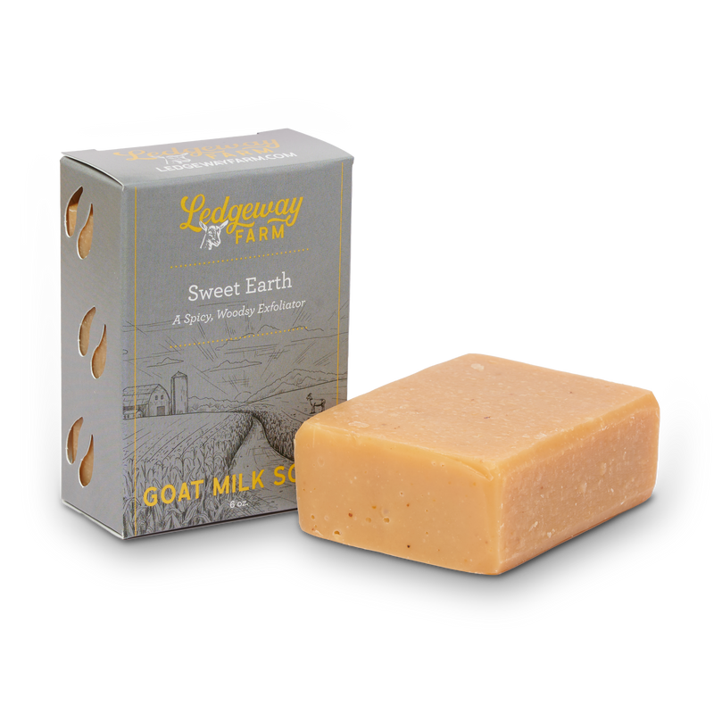 Bar of goat milk soap with packaging labeled 'Sweet Earth' from Ledgeway Farm on a white background.