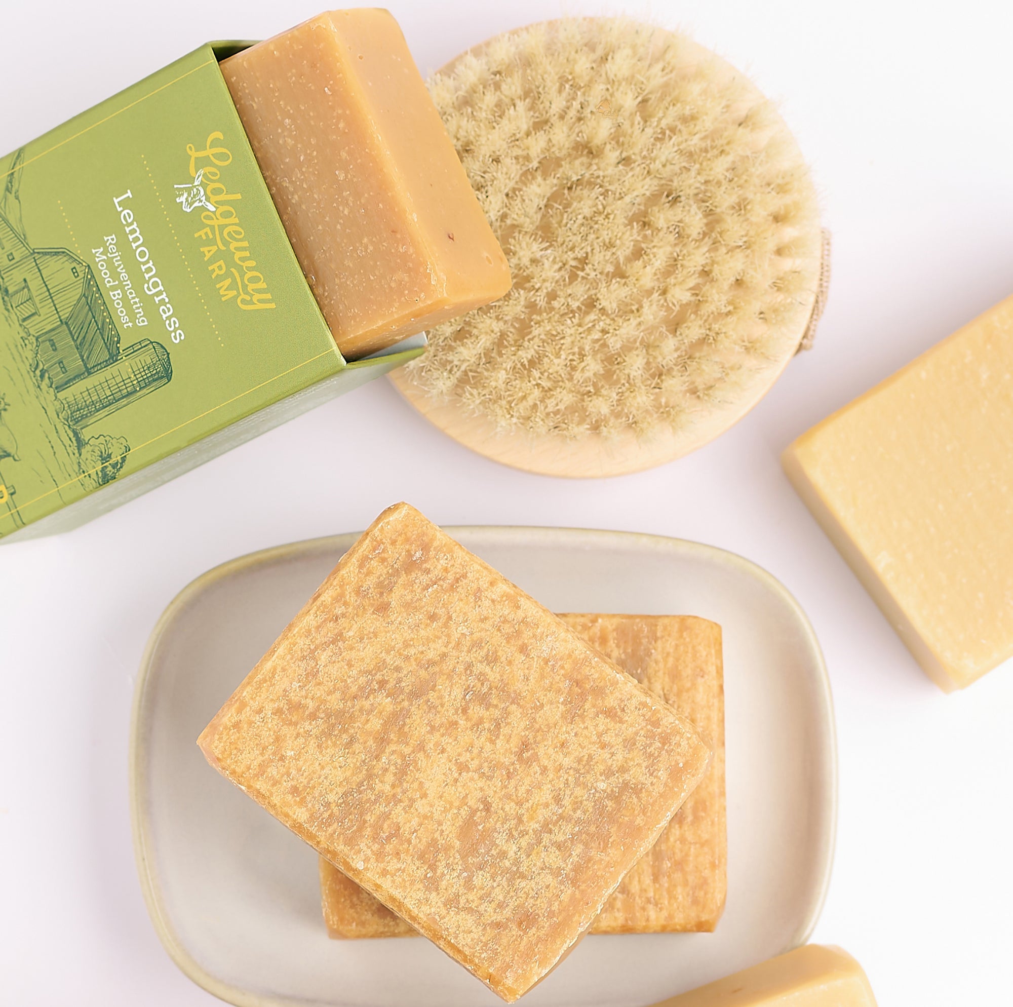 Bar of soap with a green box labeled 'Lemongrass' on a white background