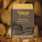Ledgeway Farm goat milk soap bar with packaging on a wooden background