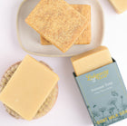Goat milk soap with packaging on a white background
