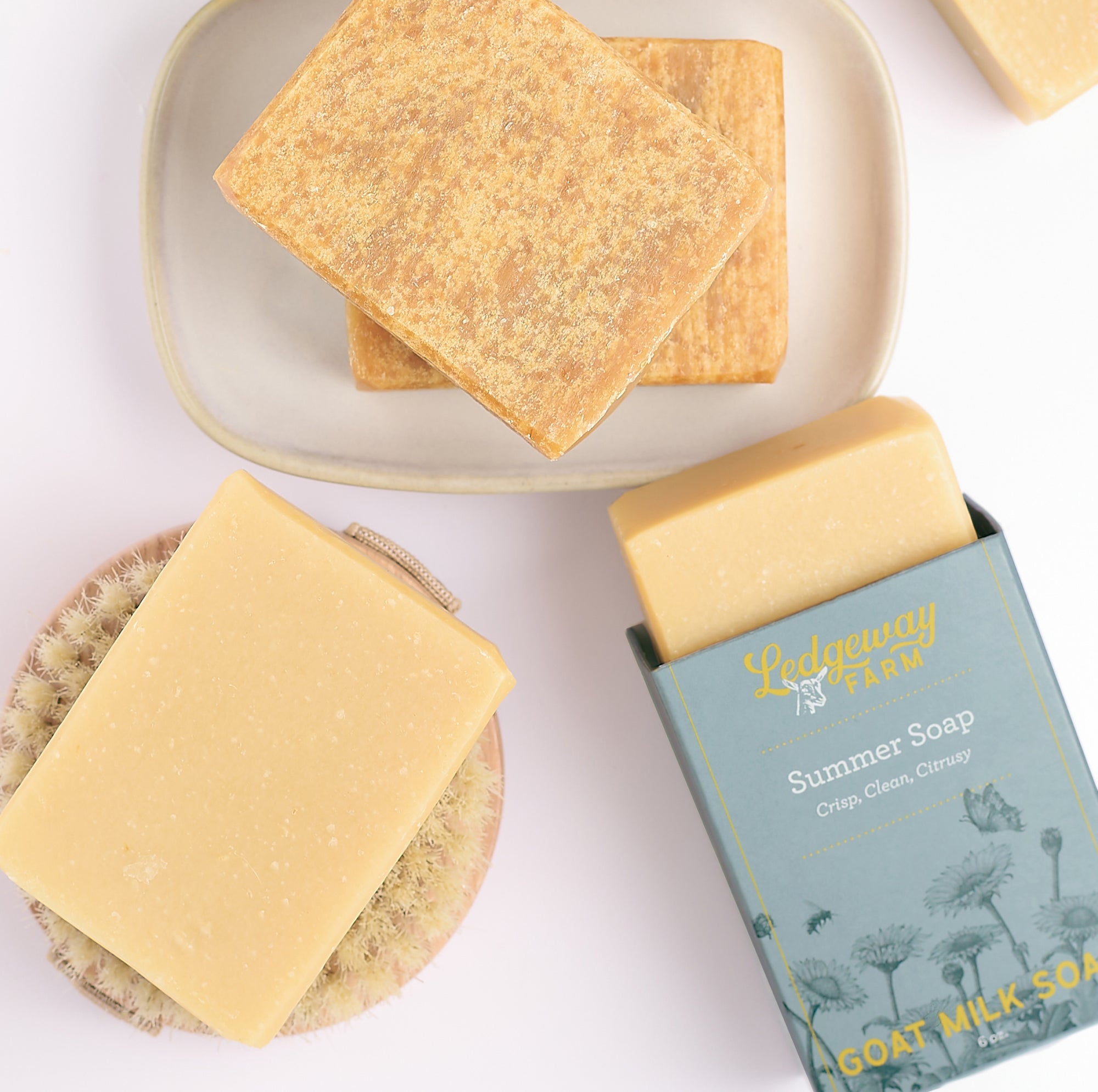 Goat milk soap with packaging on a white background