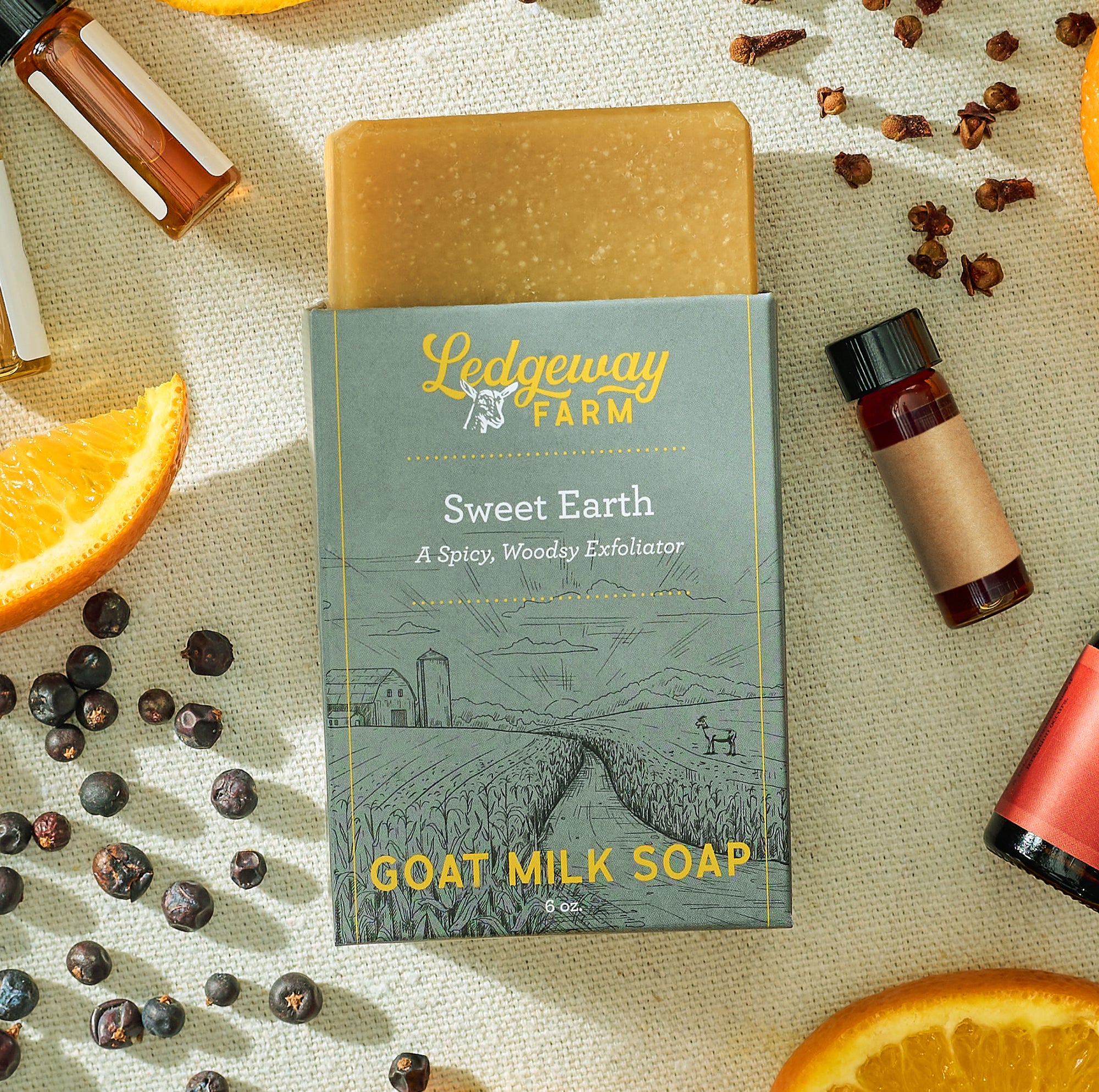 Ledgeway Farm Sweet Earth goat milk soap with ingredients on a textured surface