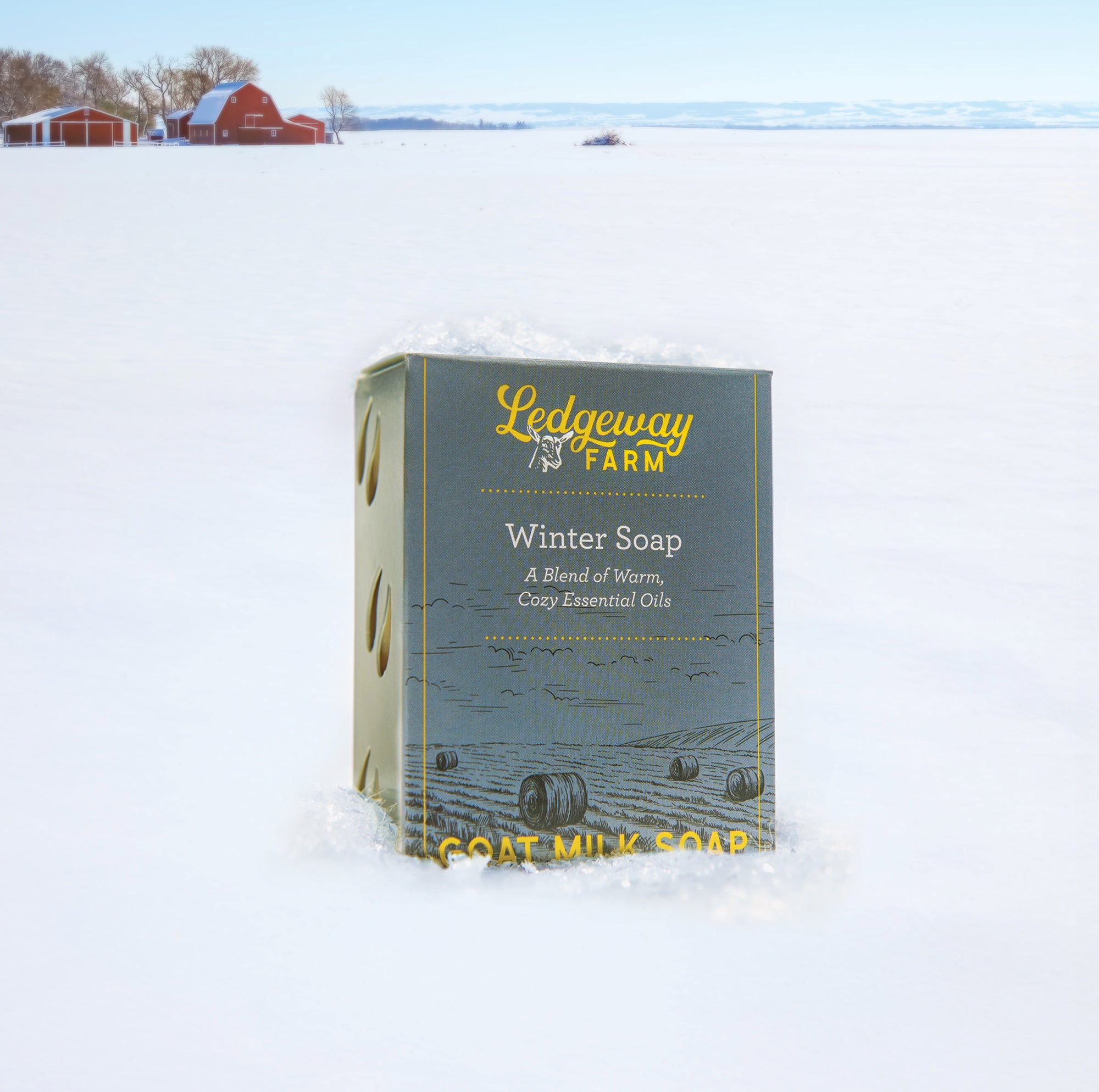 Ledgeway Farm winter soap bar in the snow with a barn in the background